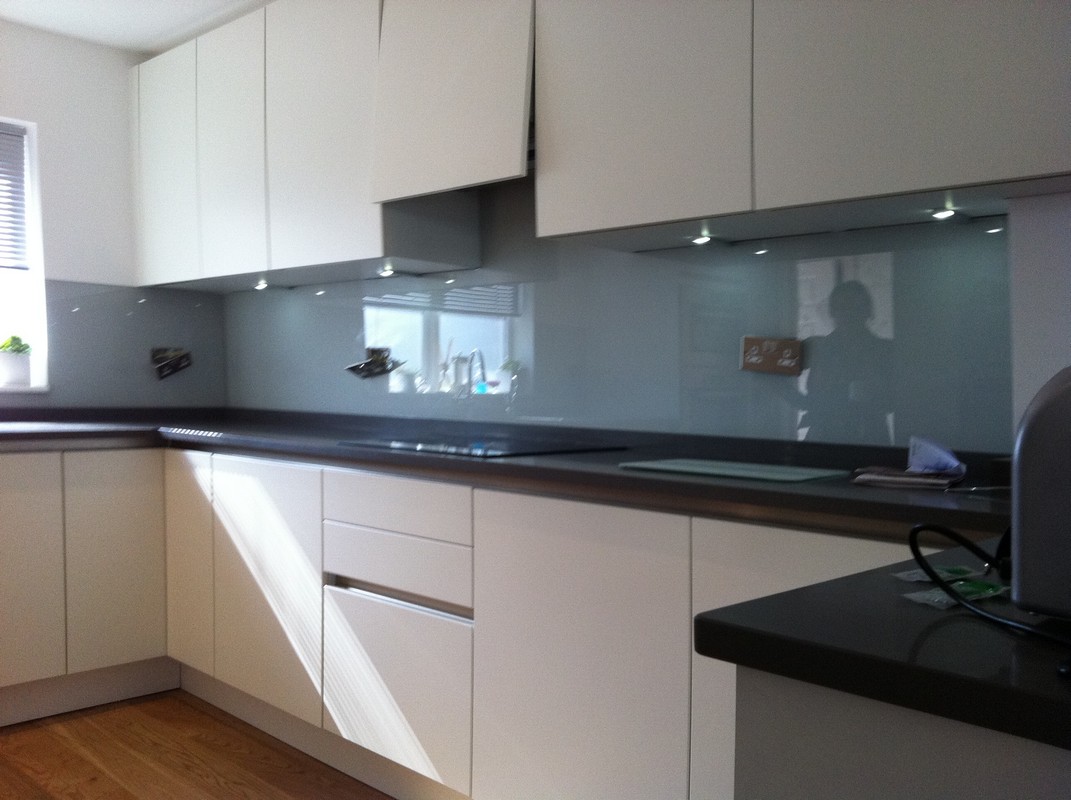Grey glass kitchen splashback with LED lighting in Staines-upon-Thames