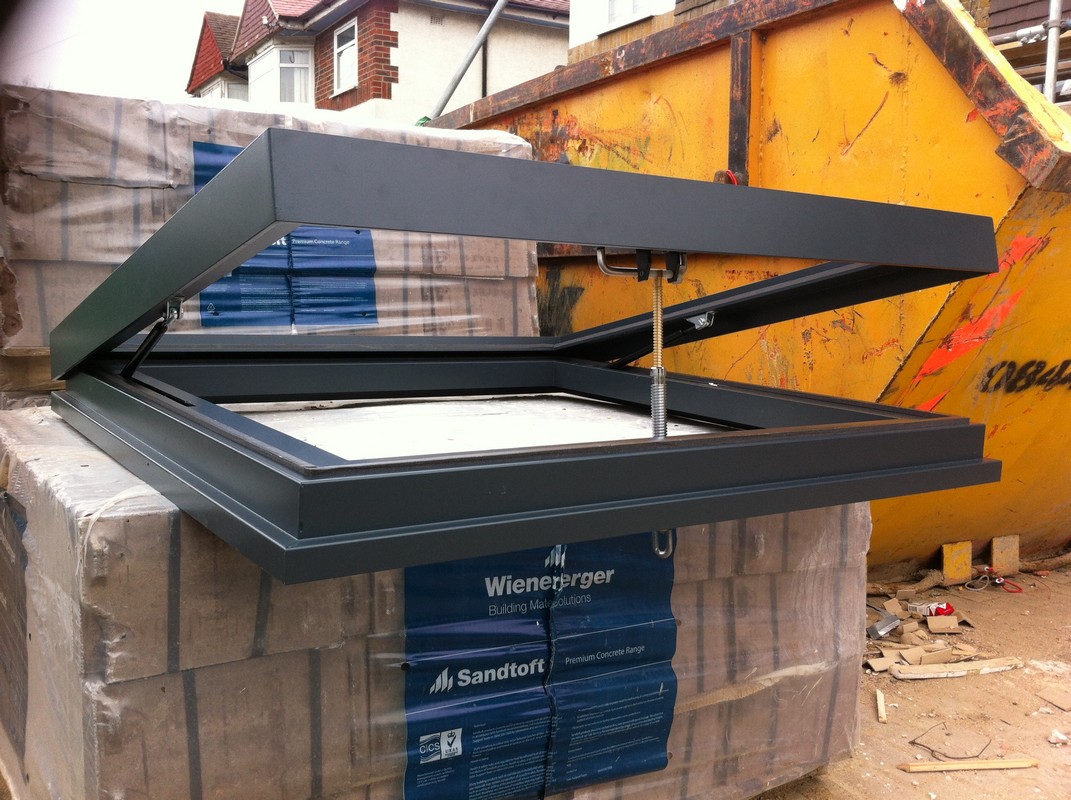 Opening flat roof skylight in anthracite grey installed in Staines-upon-Thames